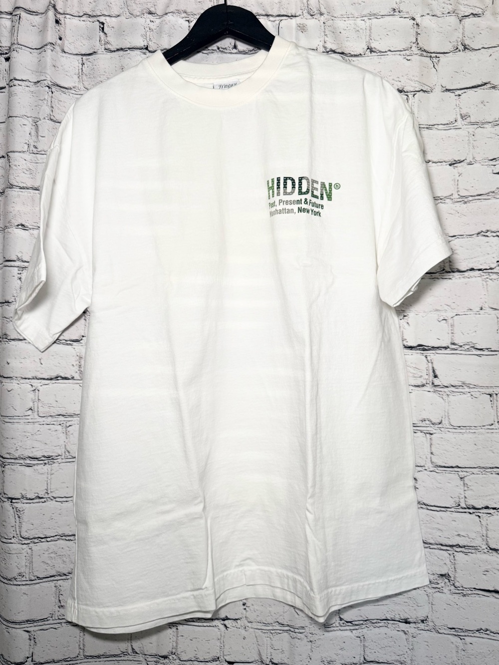 Hidden. White Men's Graphic Tee - Green Logo. Size XL